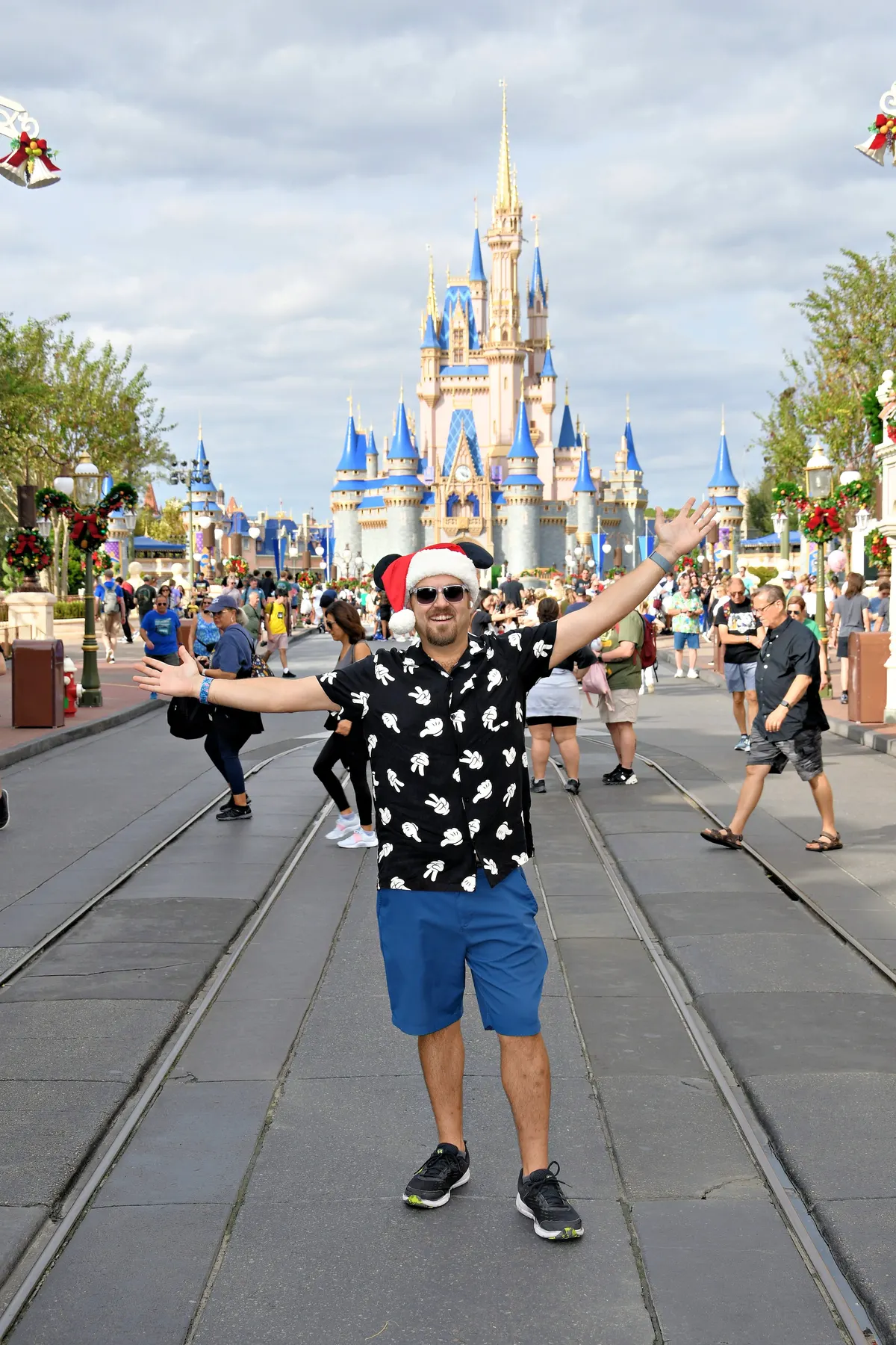 Mark Ambrose at Magic Kingdom in front of Cinderella Castle